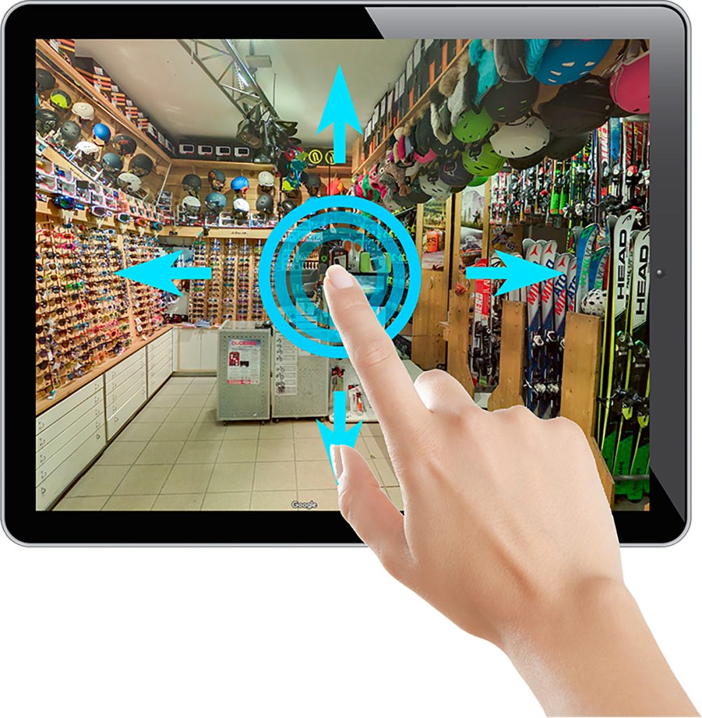 Tablette iPad présentant une visite virtuelle d'un magasin de détail lumineux, démontrant l'application des tours virtuels pour les espaces commerciaux et le commerce.